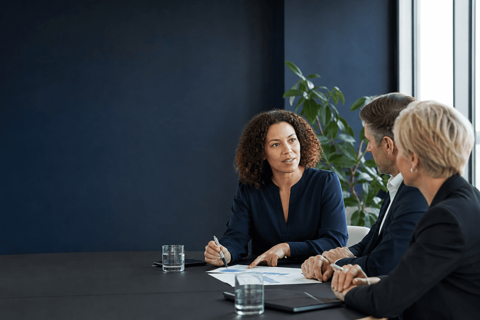 An HR leader discussing workforce planning with two business owners